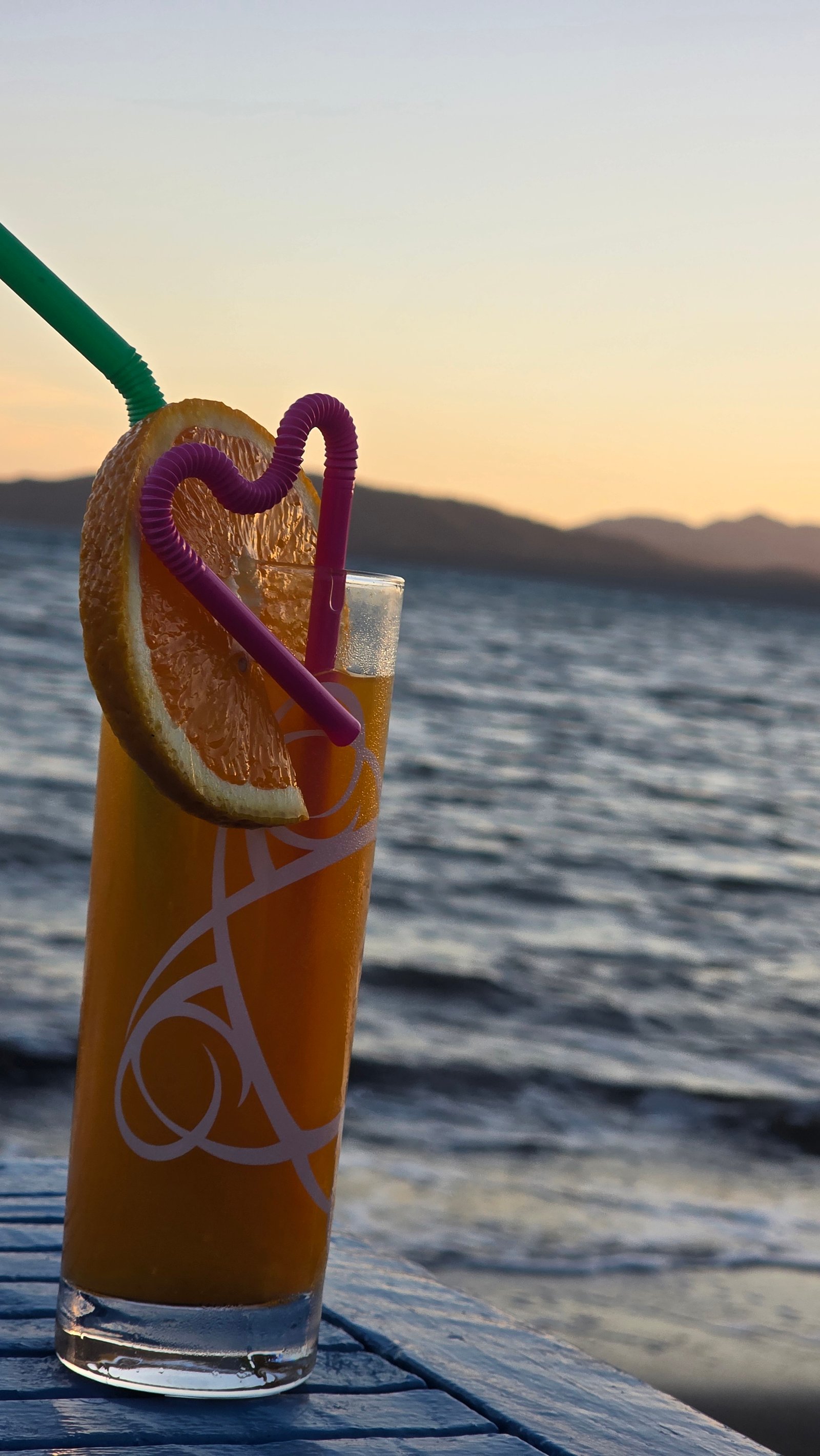 Seaside drink at sunset